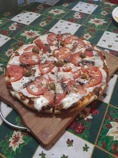 Una foto de Pizza casera con la masa perfecta