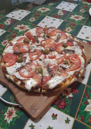 Una foto de Pizza casera con la masa perfecta