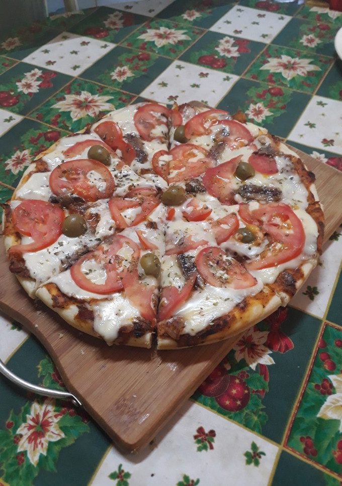 Una foto de Pizza casera con la masa perfecta
