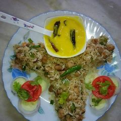 A picture of Fried Rice with kadhi boondi.
