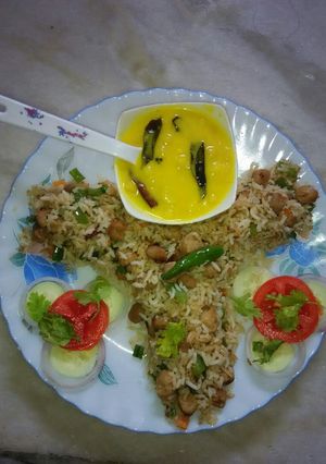 A picture of Fried Rice with kadhi boondi.