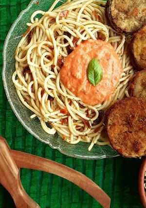 A picture of Parmigiana with herbed spaghetti.
