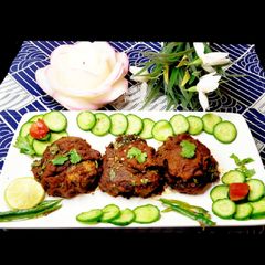 Peas Stuffed Shami Kabaab In Spicy Tomato Masala A picture of Peas Stuffed Shami Kabaab In Spicy Tomato Masala.