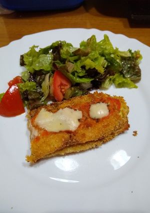 Una foto de Berenjena y zucchini rellenos