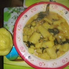A picture of Matoke and spinach.