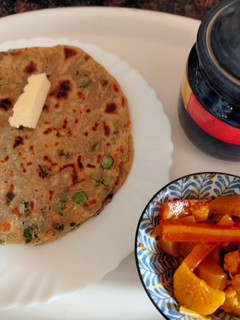 A picture of Methi, spring onion and cheese paratha.