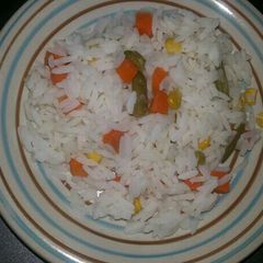A picture of Rice and mixed vegetables.