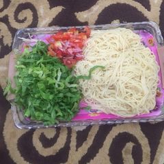 A picture of White spaghetti with salad.