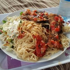 A picture of Pasta with pepper sauce and coleslaw.