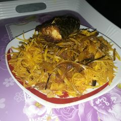 A picture of Abacha with fried fish.