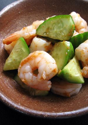 A picture of Cucumber & Prawns with Kimchi Flavoured Sauce.