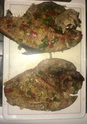 A picture of Oven-roasted Fish with Peppers.