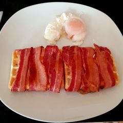A picture of My Streaky Bacon wrapped Waffles with Maple Syrup. 😍.