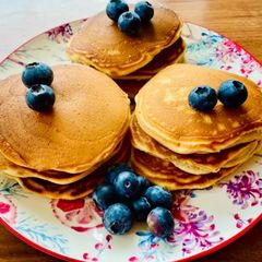 A picture of Pancakes with coconut milk.