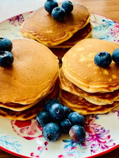 A picture of Pancakes with coconut milk.