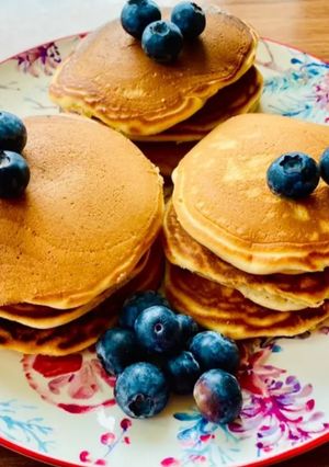 A picture of Pancakes with coconut milk.