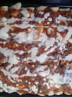 Una foto de Canelones de acelga y carne picada