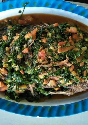 A picture of Fried fish with sukuma wiki.