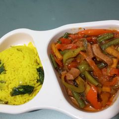 A picture of Turmeric rice and sausage sauce.