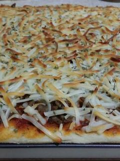 Una foto de Pizza con carne