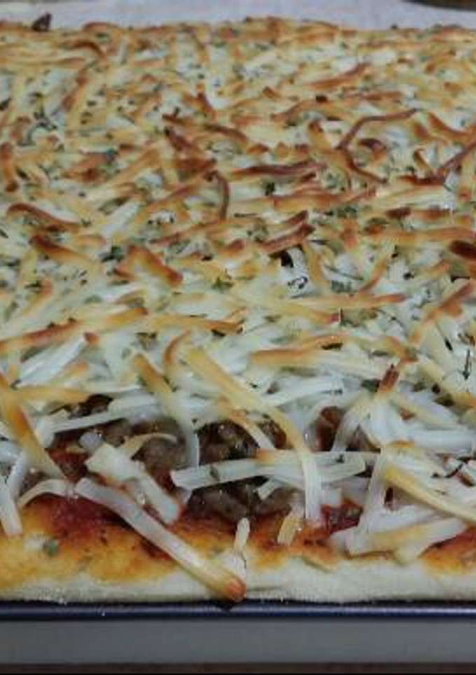 Una foto de Pizza con carne