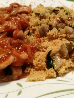 Una foto de Calamares con cous cous