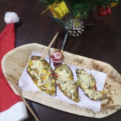 A picture of Healthy sweet potato with veggies and cheez.