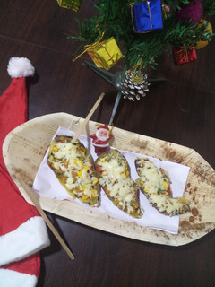 A picture of Healthy sweet potato with veggies and cheez.