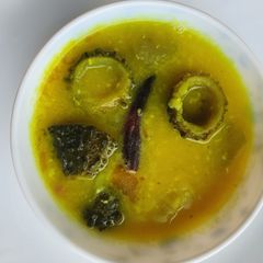 A picture of Bitter & Bottle Gourd with yellow Lentils (lau r ucche daal).