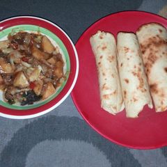 A picture of Roti with cabbage nd potatoe soup.