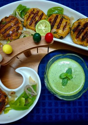A picture of Dahi Chicken Kabab with a Yogurt Mint Coriander Dip.