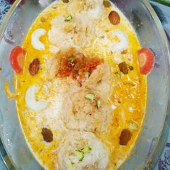 A picture of Halwa balls in carrot rabdi.