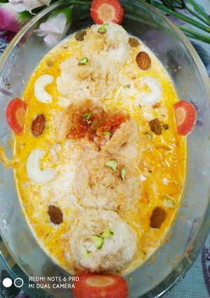 A picture of Halwa balls in carrot rabdi.