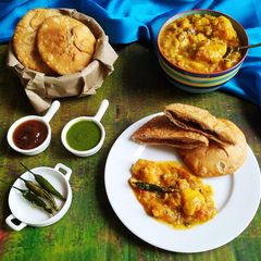 A picture of Moong dal kachori with aloo ki sabji.