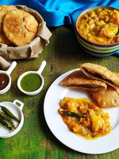 A picture of Moong dal kachori with aloo ki sabji.