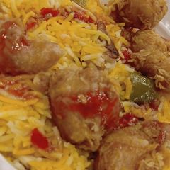 A picture of Rice and spice with tender poops chicken 🐔.