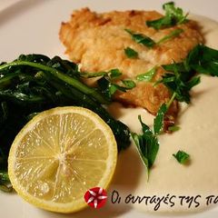 Fried cod-fish served with a garlic dip A picture of Fried cod-fish served with a garlic dip.