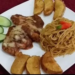 A picture of Cheesy Chicken with spaghetti & potato wedges.