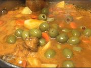 Una foto de bolillos con guisado