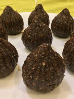 A picture of Dates and dark chocolate ganache modaks.
