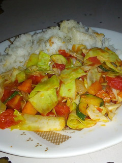A picture of Rice with stir fry vegetables.
