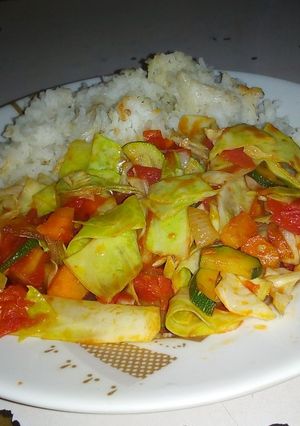 A picture of Rice with stir fry vegetables.