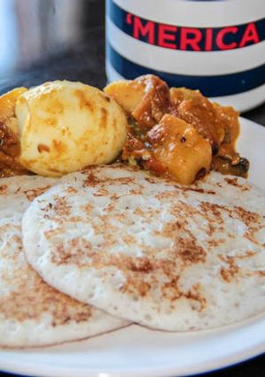 A picture of Kallappam & Nadan Mutta Curry- Coconut Pancakes & Egg Curry.
