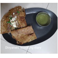 A picture of Paneer cheese stuffed Green moong dal chilla.