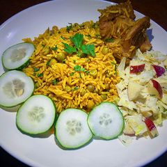 Jollof rice with green peas and turkey A picture of Jollof rice with green peas and turkey.