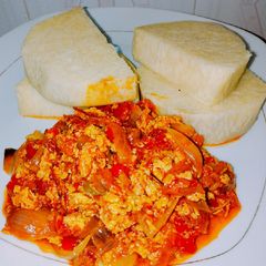 Boiled yams and tomato egg sauce A picture of Boiled yams and tomato egg sauce.