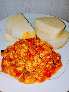 A picture of Boiled yams and tomato egg sauce.