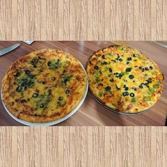 A picture of Chicken tikka pizza.