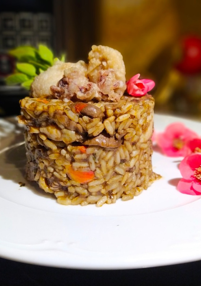 Una foto de Arroz Negro con Chipirones en Olla GM