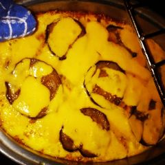 A picture of Greek Style Aubergine and Capemalay Mince Bobotie.